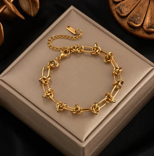 Gold bracelet with modernist chain