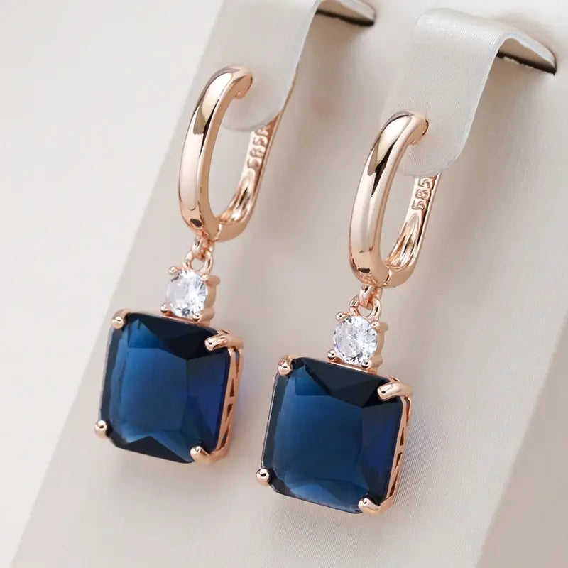 1+1 Offer: Elegant earrings with dark blue crystal in gold