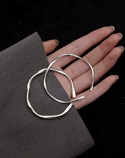 Silver bracelet, adjustable and irregular in shape